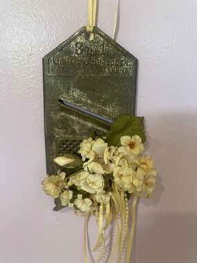 Vintage metal shredder repurposed with flowers - wall hanging